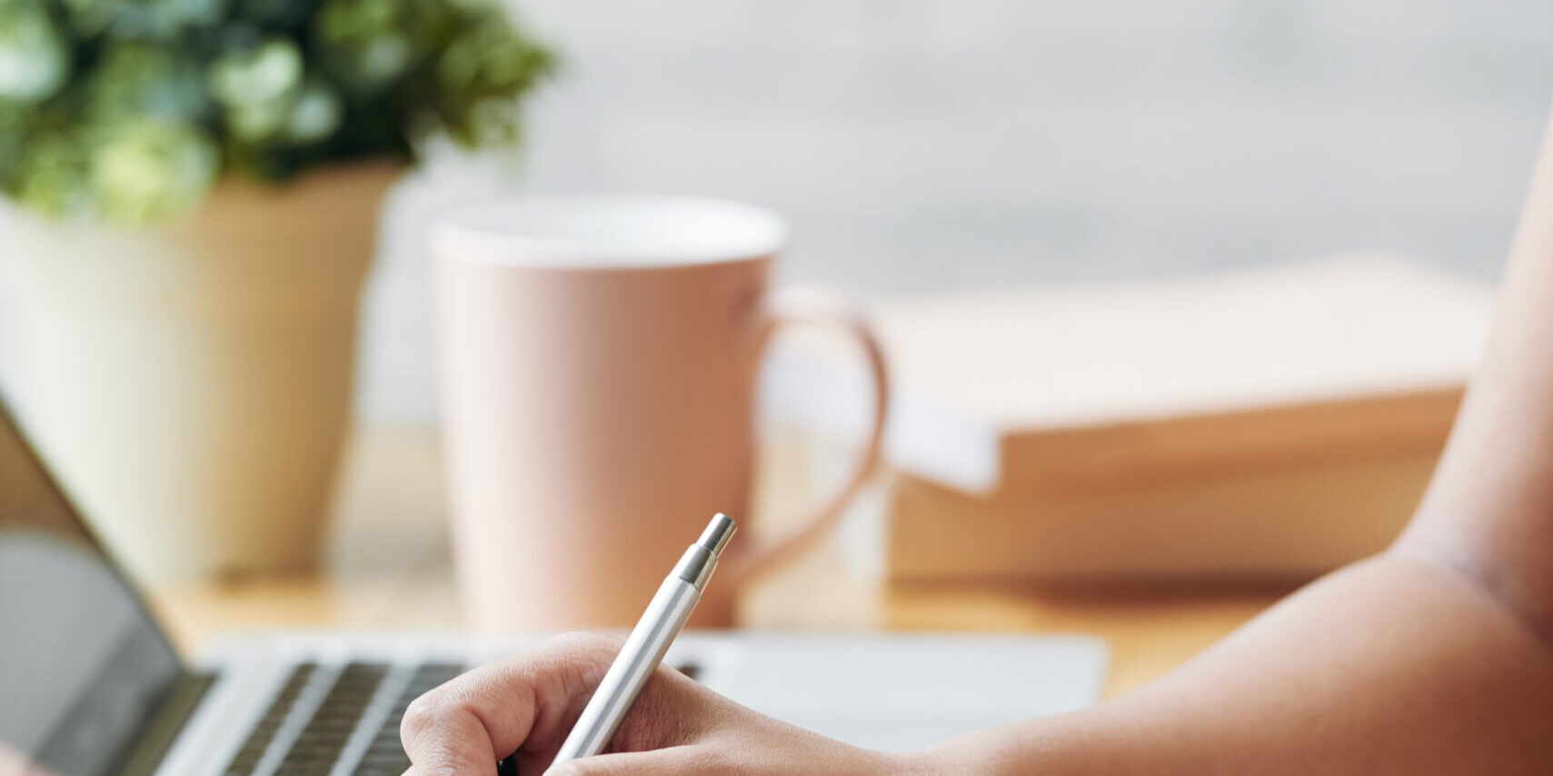 Hands of business lady writing schedule for the upcoming week